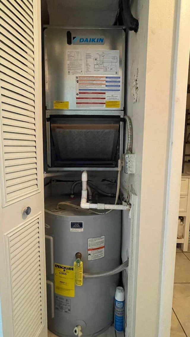 utility room featuring electric water heater