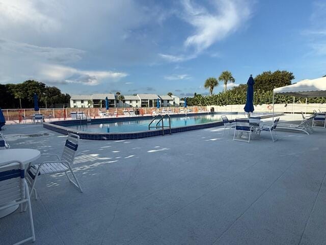 view of swimming pool featuring a patio area