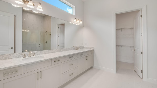 bathroom featuring vanity and an enclosed shower