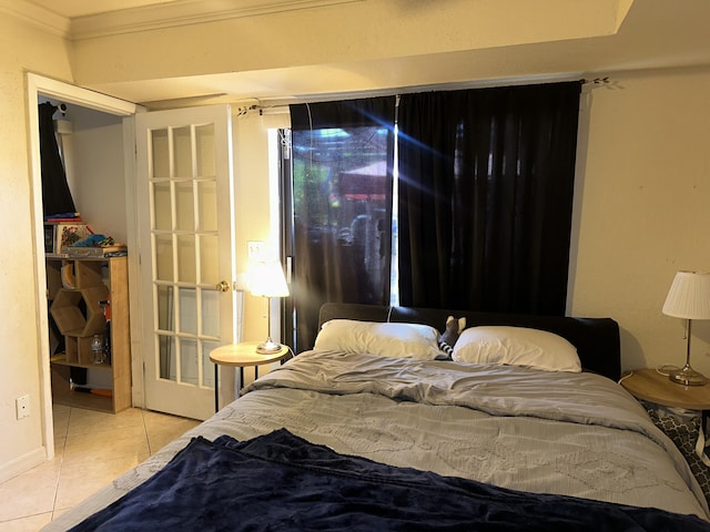 tiled bedroom featuring crown molding