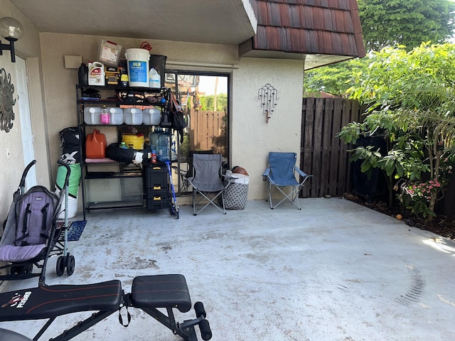 view of patio featuring fence