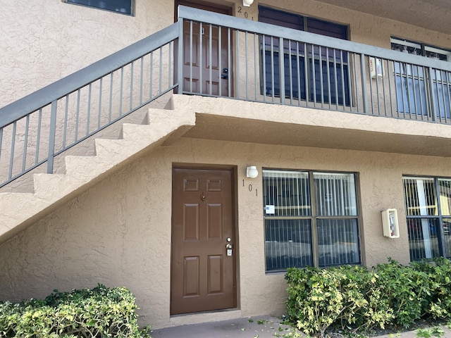 doorway to property featuring a balcony