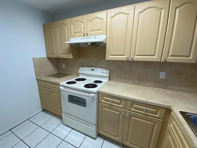 kitchen featuring decorative backsplash, light brown cabinetry, sink, light tile patterned floors, and electric range