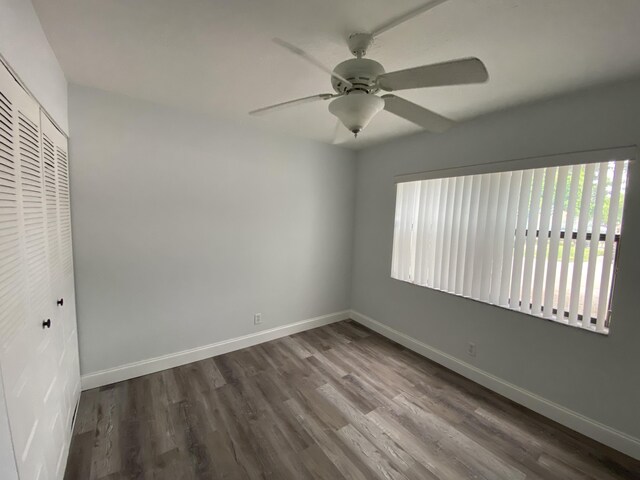 interior space featuring ceiling fan and dark hardwood / wood-style flooring