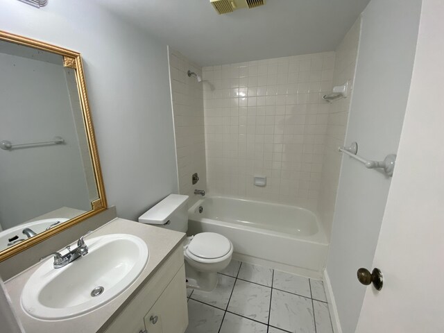 full bathroom featuring vanity, toilet, and tiled shower / bath