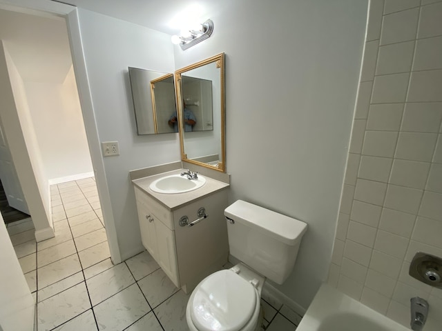 bathroom with tile patterned floors, vanity, and toilet