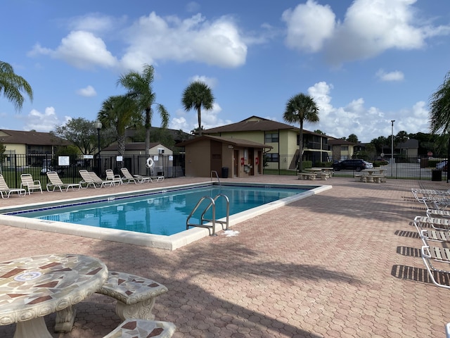 view of swimming pool featuring a patio area