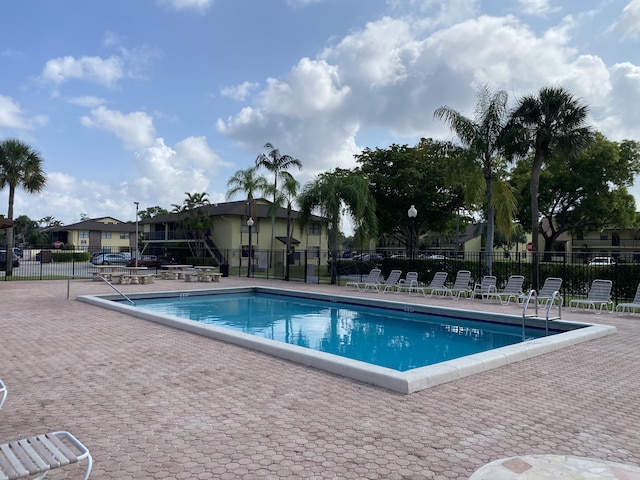 view of swimming pool with a patio