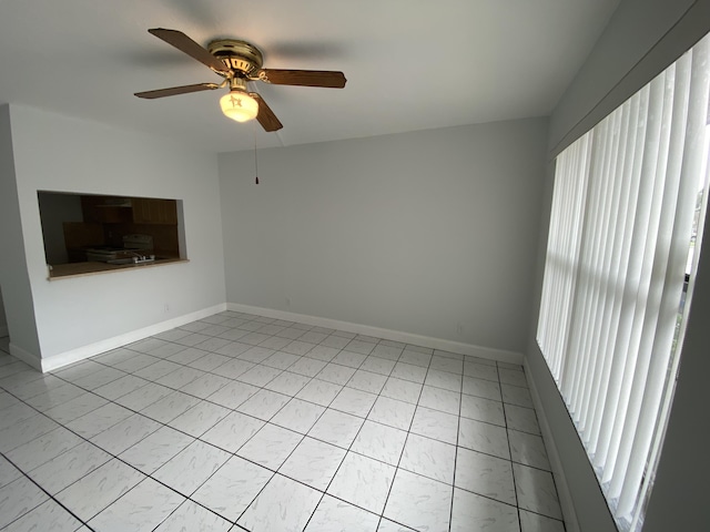 interior space with ceiling fan