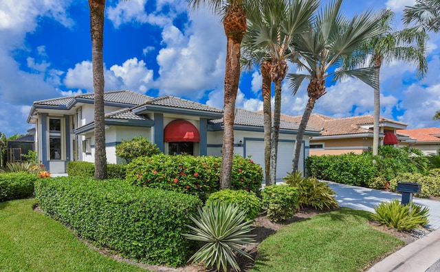 mediterranean / spanish-style home with a garage