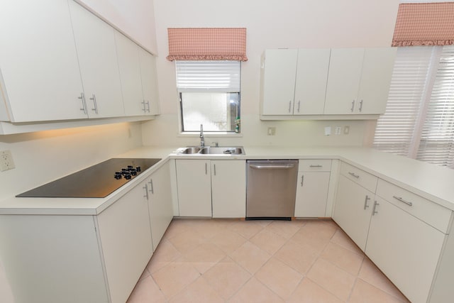 kitchen featuring black electric stovetop, stainless steel dishwasher, sink, light tile patterned floors, and white cabinets