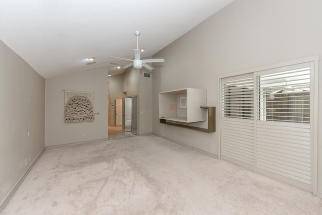 unfurnished living room featuring light colored carpet, high vaulted ceiling, and ceiling fan