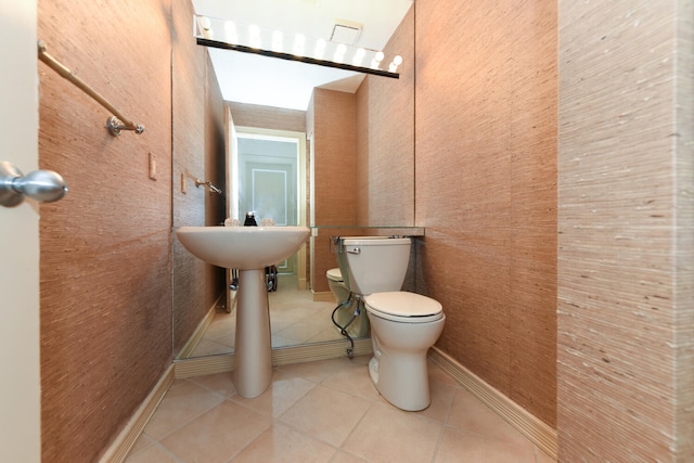 bathroom with tile patterned flooring and toilet