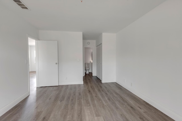 spare room featuring light hardwood / wood-style flooring