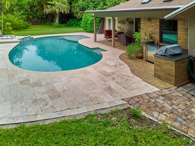 view of pool featuring a yard and a patio area