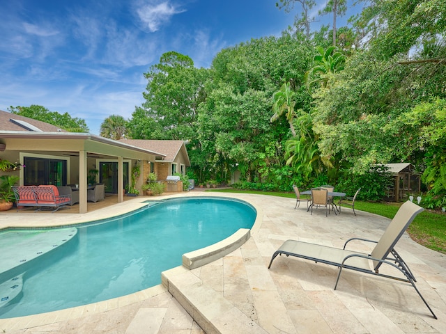 view of pool featuring a patio and an outdoor hangout area