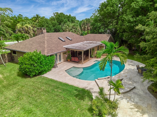 view of pool featuring a yard and a patio area