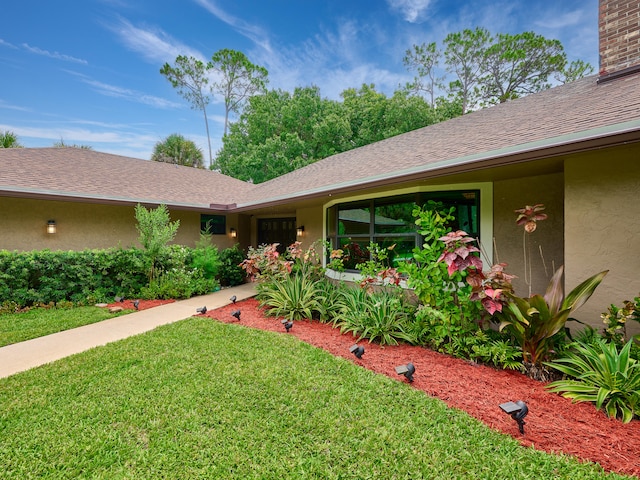 view of front of home with a front yard