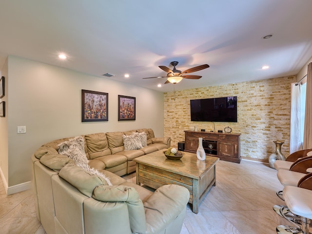 tiled living room featuring ceiling fan