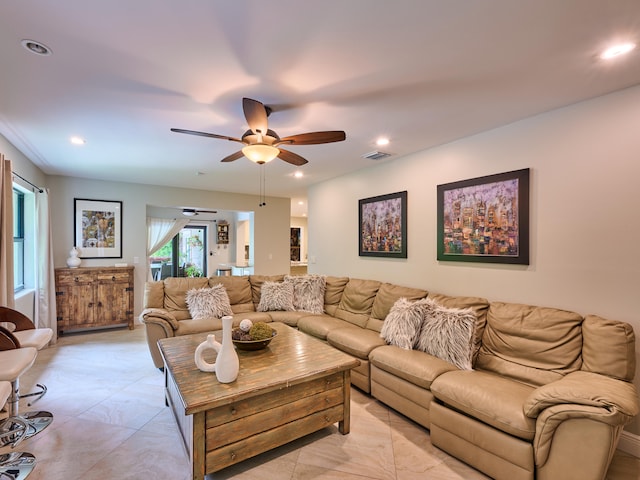 tiled living room featuring ceiling fan