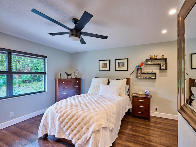 bedroom featuring dark hardwood / wood-style flooring and ceiling fan