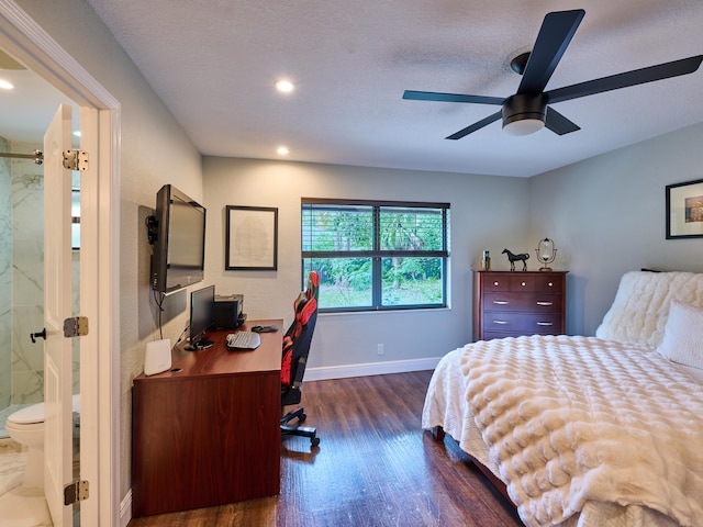 bedroom with dark hardwood / wood-style flooring, ensuite bath, a textured ceiling, and ceiling fan