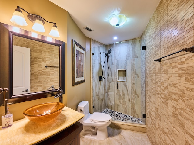 bathroom featuring vanity, toilet, and tile patterned floors