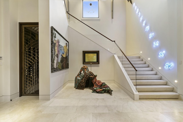 stairs with a towering ceiling