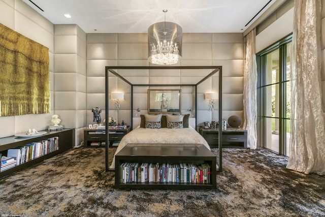 bedroom featuring carpet and a chandelier