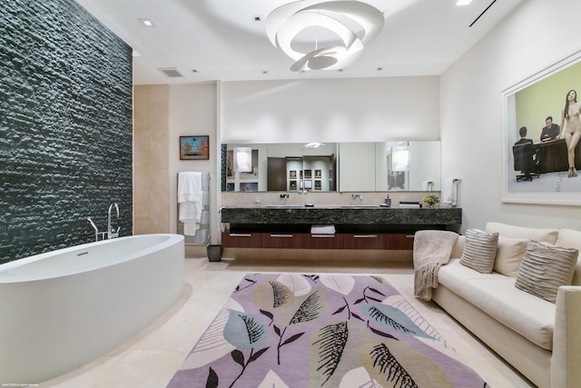 bathroom with a bathing tub and vanity