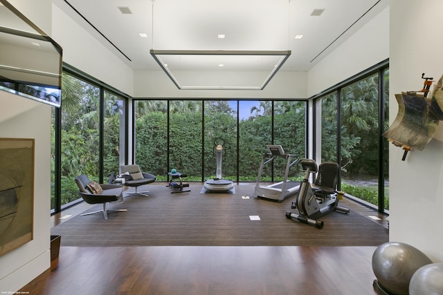 gym with dark hardwood / wood-style flooring