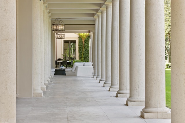 view of exterior entry with a patio area