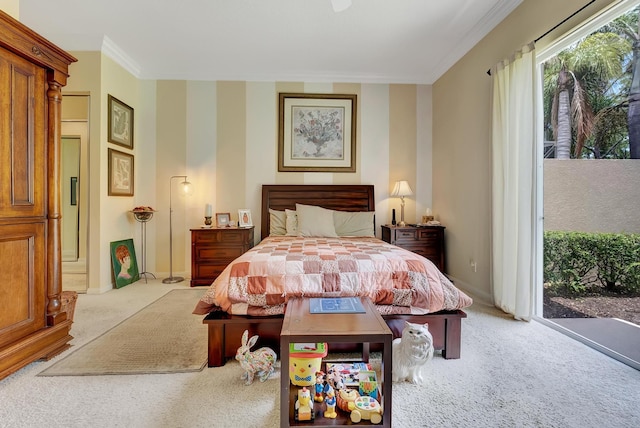 carpeted bedroom featuring ornamental molding and access to outside