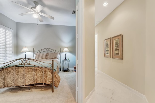 tiled bedroom with ceiling fan