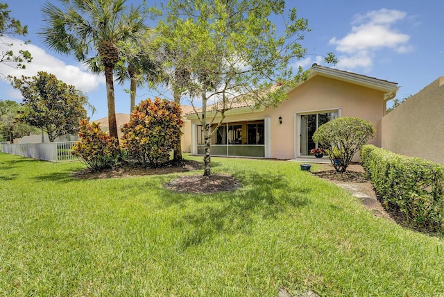 view of yard with a sunroom