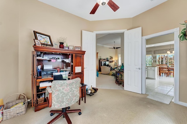 office with ceiling fan and light tile patterned flooring