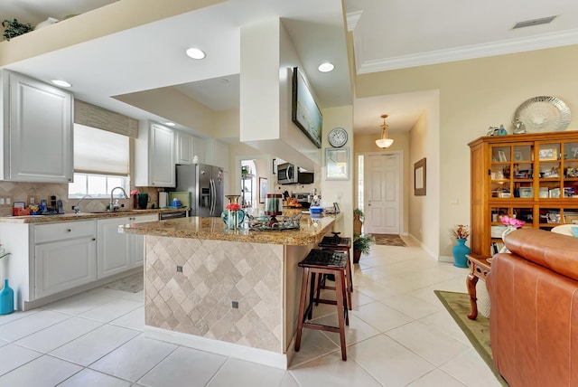 kitchen with white cabinets, kitchen peninsula, light tile patterned floors, and stainless steel refrigerator with ice dispenser