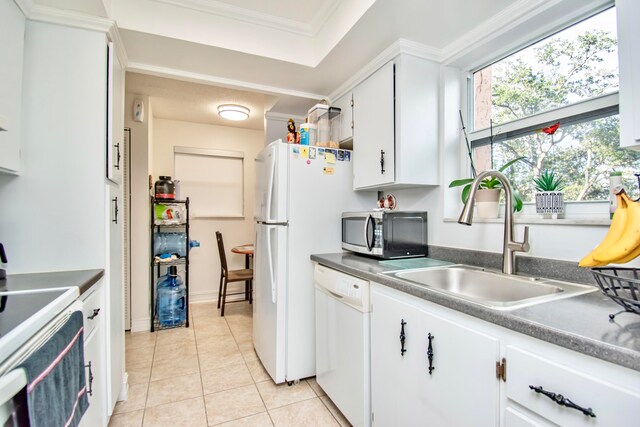 kitchen with white cabinetry, crown molding, white appliances, light tile patterned floors, and sink