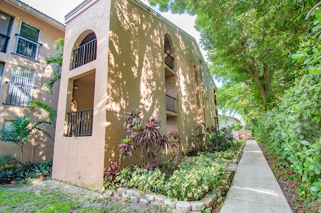 view of property exterior with a balcony