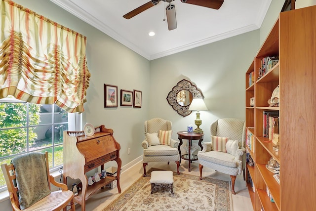 living area featuring light wood-type flooring, ceiling fan, and ornamental molding