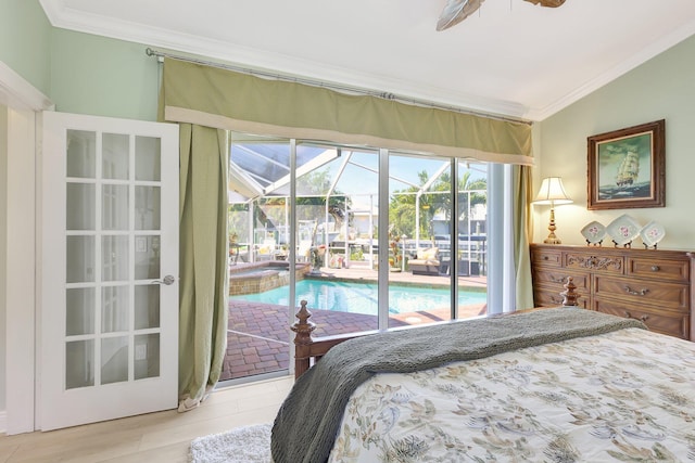 bedroom featuring access to exterior, ceiling fan, vaulted ceiling, and ornamental molding