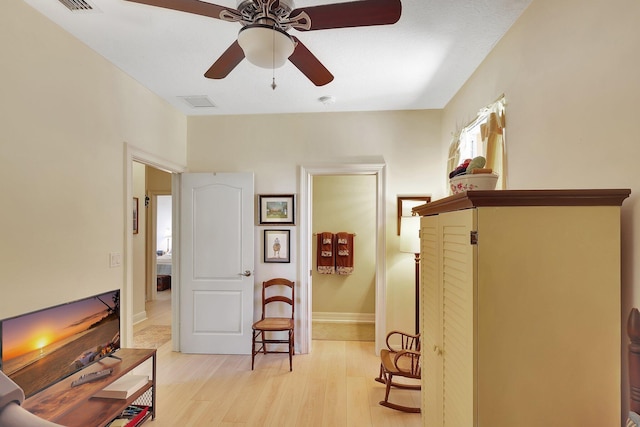 interior space featuring light hardwood / wood-style floors and ceiling fan