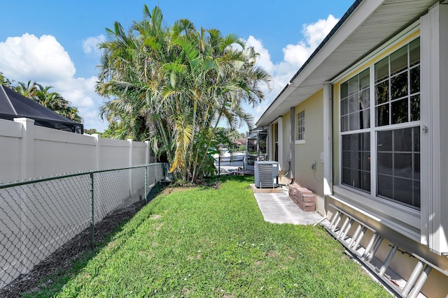 view of yard featuring central AC