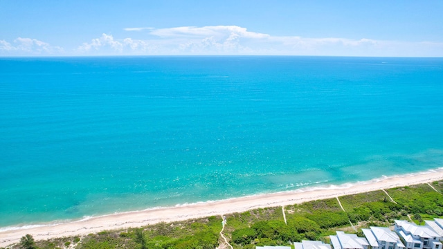 drone / aerial view with a view of the beach and a water view