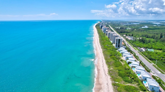 aerial view with a view of the beach and a water view