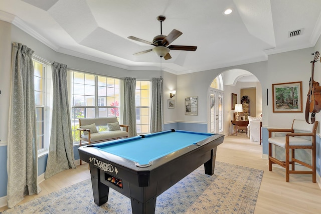 recreation room featuring crown molding, billiards, light hardwood / wood-style flooring, ceiling fan, and a tray ceiling