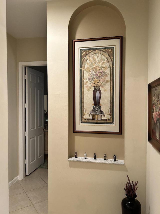 hallway featuring light tile patterned flooring