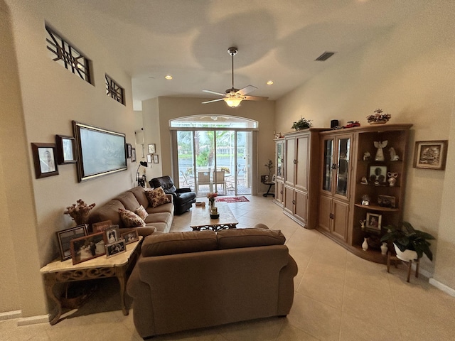 living room featuring light tile patterned floors, visible vents, lofted ceiling, ceiling fan, and recessed lighting