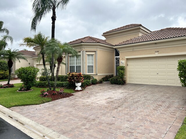 mediterranean / spanish-style house featuring a garage