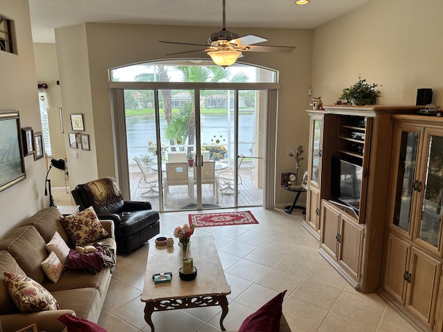 living room featuring ceiling fan and light tile patterned flooring